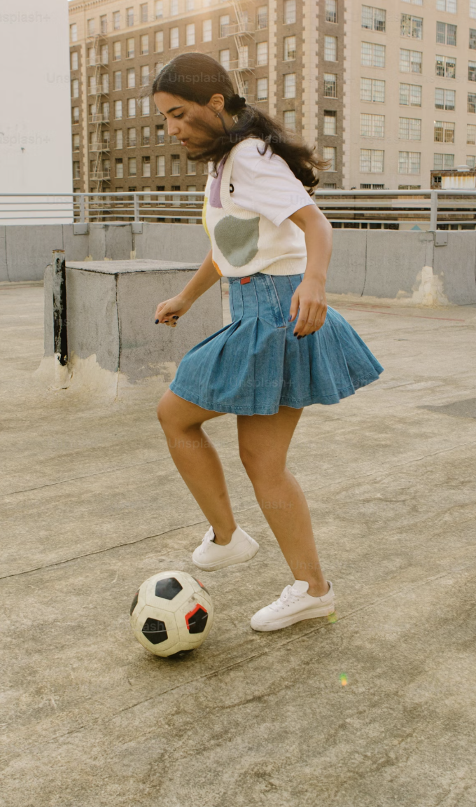 girl roof playing soccer